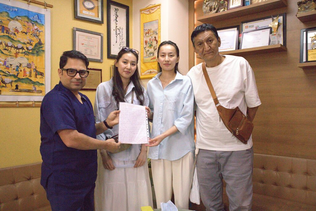 Father from Kyrgyzstan with his two daughters and the liver transplant team after a successful world-first laparoscopic dual-lobe living donor liver transplant at AILBS.